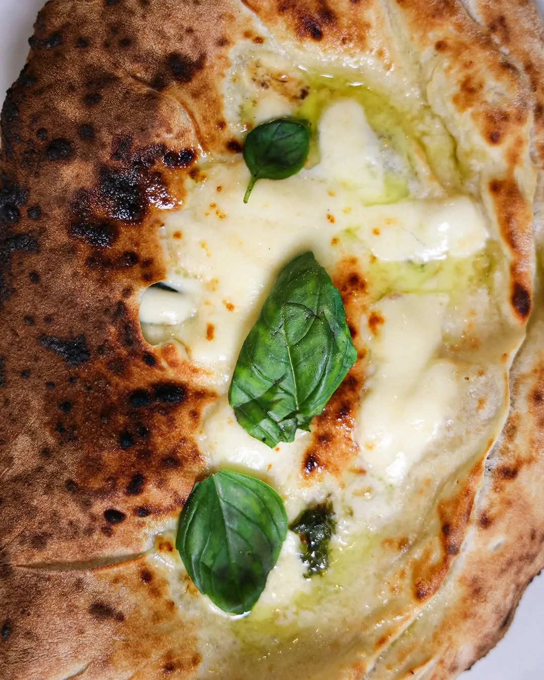 The crust of a freshly baked Neapolitan pizza